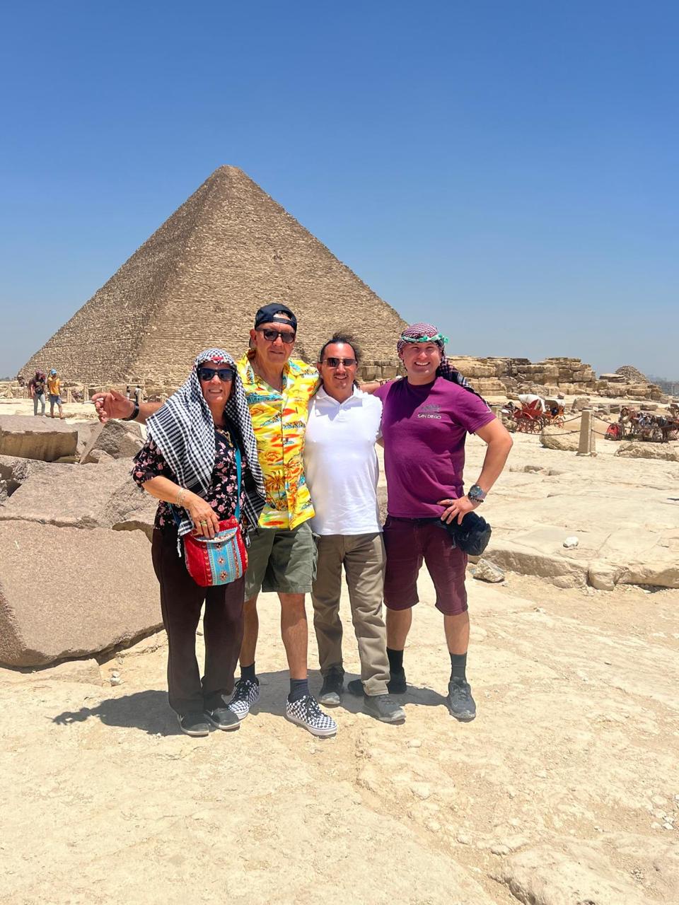 Group of happy tourists at the Pyramids